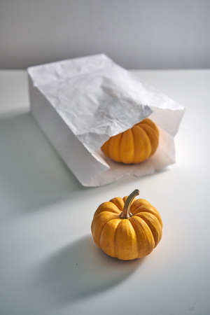 Sweet, small, orange pumpkins from the trick or treat bags. Halloween theme.の写真素材