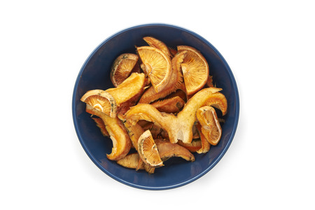 Bowl of fresh chantarelle and saffron milk cup mushroom close-up on white background.の写真素材