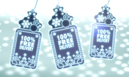 three 3d rendered christmas cards with 100 percent free delivery sign on ice blue blurred background with snow and glaring starsの写真素材