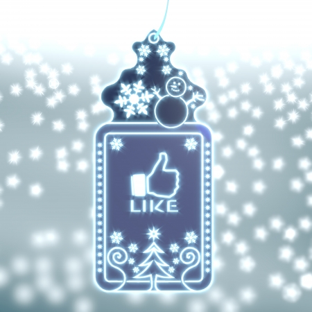shiny christmas labe with like sticker on ice blue blurred background with snow and glaring starsの写真素材