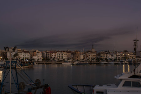 Spectacular view of the port of Tarragona. Spain. Few minutes before dusk on an October day. One can enjoy the view of a sky full of clouds covering the whole port.の写真素材