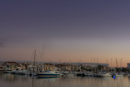 Spectacular view of the port of Tarragona. Shortly after sunset on an October day. One can enjoy the view of a sky full of clouds covering the whole port.の写真素材
