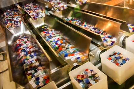 Colorful plastics boxes in the line of industryの写真素材