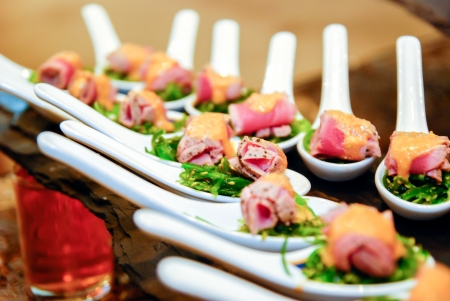 Seaweed salad with meat in the spoonの写真素材