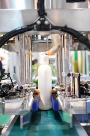 Plastic bottle on the conveyorの写真素材