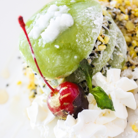 Green tea mochi with whipping creamの写真素材