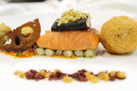 Salmon with side dishes on the plateの写真素材