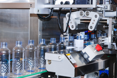Bottling water on the process in factory の写真素材