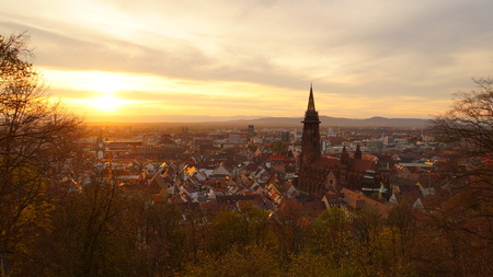 Romantic evening mood over the City of Freiburg im Breisgau from Kanonenplatzの写真素材