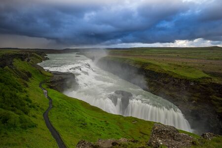 Iceland - Majestic waterfall Gulf at dawn with cloudsの写真素材