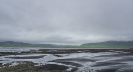 Iceland - Volcanic black lava ground at southern icelandの写真素材