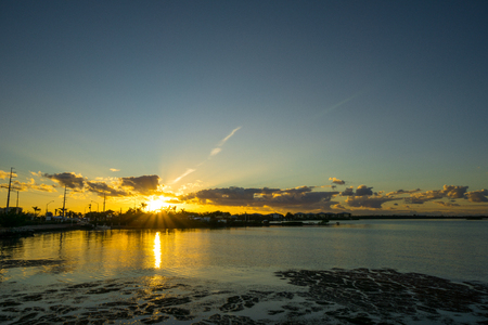 USA, Florida, Orange burning sky sunset reflecting in ocean on florida keys villageの写真素材