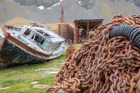an old fisher village in the mountains of antarctica with old houses
