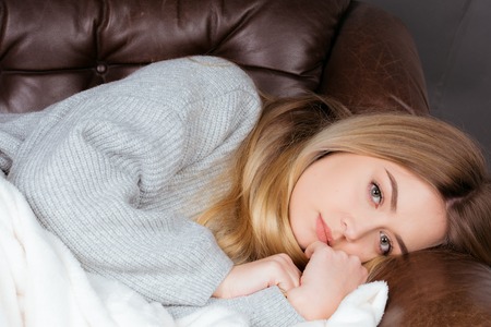 a gild is sick and needs care for her health and has painの写真素材