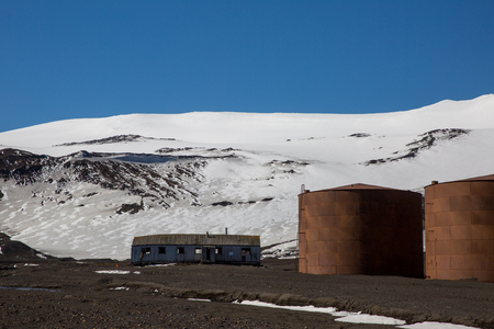 an old fisher village in the mountains of antarctica with old housesの写真素材