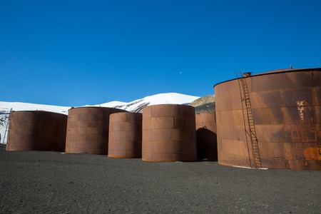 an old fisher village in the mountains of antarctica with old housesの写真素材