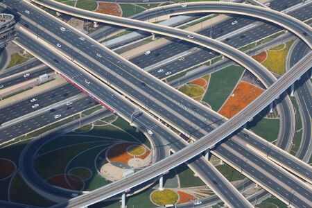 Amazing aerial view of the junction roads seen from above from the top of the Burj Khalifa. Traffic...