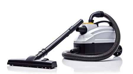 A close-up of a hand holding a vacuum cleaner hose, showcasing the convenience and efficiency of modern home cleaning.の素材