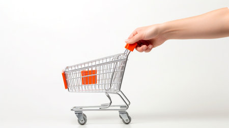 Emphasize the everyday act of grocery shopping as hands push a cart through the supermarket, fulfilling daily essentials.の素材