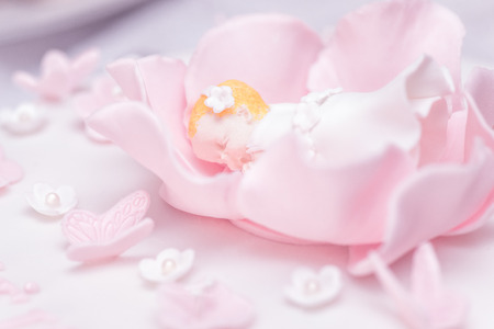 Christening cake decoration - sleeping babyの写真素材