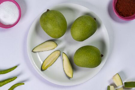 green mangoes on tableの写真素材