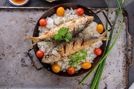 Crispy Delight: Deep Fried Fish over Fluffy White Steamed Rice in 4K Close-Upの写真素材