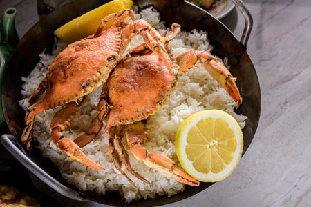 Savor the Flavor: Top a Close-Up of Deep Fried Crab over White Steamed Rice with Lemon in 4Kの写真素材