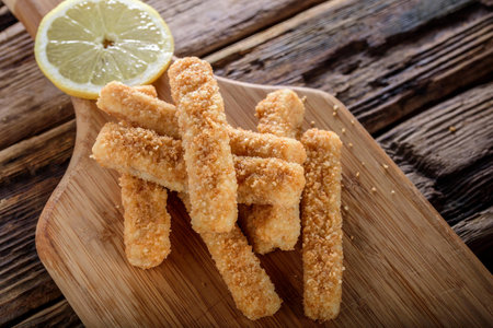 Crispy and Zesty: Panko-Breaded Fish Sticks with Lemon in Exquisite 4K Close-Uの写真素材