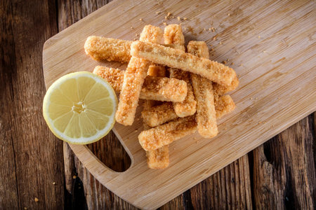 Crispy and Zesty: Panko-Breaded Fish Sticks with Lemon in Exquisite 4K Close-Upの写真素材