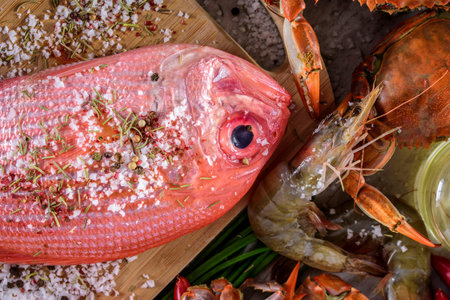Exquisite Delights: Fresh New Zealand Red Snapper fish and Crab Infused with Salt, Spices, and Zesty Lemon in 4Kの写真素材