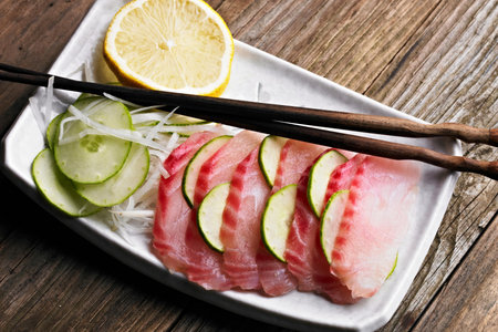 Artistry on a Plate: Close-Up of Fresh Tilapia Sashimi in 4K Resolutionの写真素材