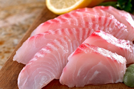 Artistry on a Plate: Close-Up of Fresh Tilapia Sashimi in 4K Resolutionの写真素材