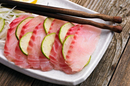 Artistry on a Plate: Close-Up of Fresh Tilapia Sashimi in 4K Resolutionの写真素材