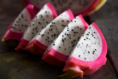 Dragon fruit on wooden table. Ripe pitahaya fruit.の写真素材