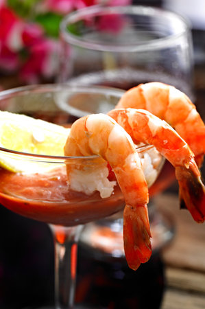 Red cocktail with shrimps on a dark background. Close-upの写真素材