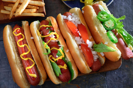 Delicious hot dogs with ketchup, mustardnnaise and vegetablesの写真素材