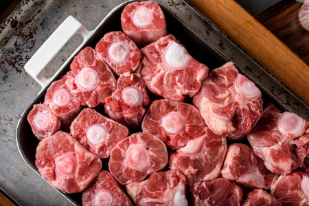 Pieces of raw meat on a frying pan. Top view.の写真素材