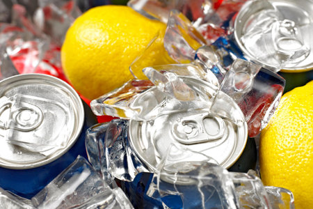 Recycling garbage, can with lemon and ice cubes, closeupの写真素材