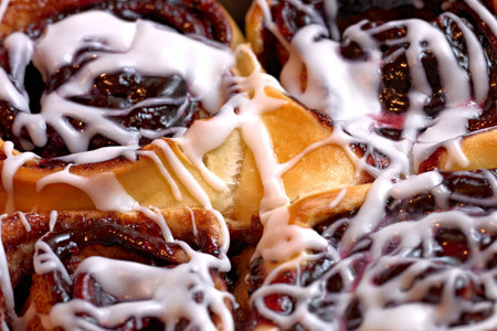 Cinnamon rolls with white icing, close-up, macro photographyの写真素材
