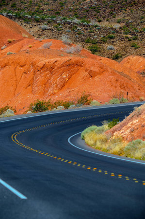 Curved asphalt road in the mountains of Painted Hills, Oregonの写真素材