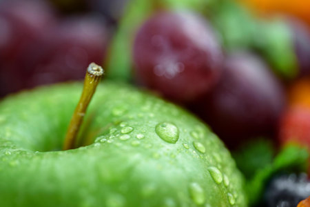 Close up of fresh fruits and vegetables with water droplets on themの写真素材