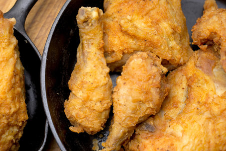 Fried chicken legs in a frying pan. Close-up.の写真素材