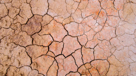 Dry cracked earth background. Cracks in the ground. Global warming concept.の写真素材