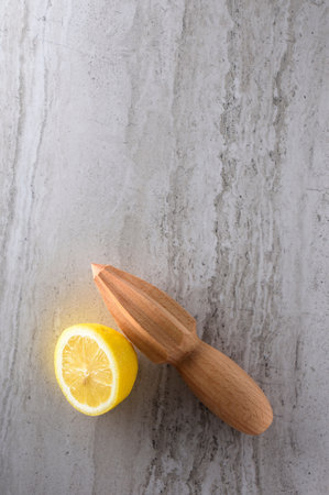 Citrus squeezer and lemon on grey background. Top viewの写真素材