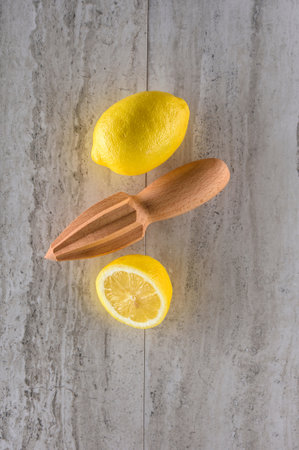 Lemon and juicer on a white background. Flat lay.の写真素材