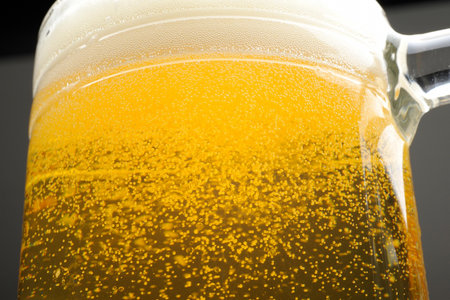 Beer in a glass on a dark background. Close-up.