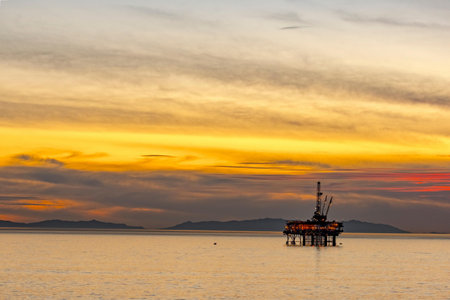 Oil and gas platform in the sea at sunset, Oil and gas industryの写真素材