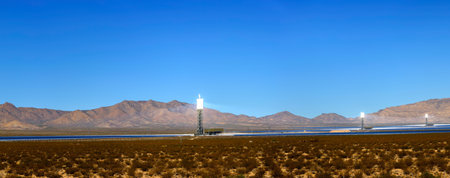 Panoramic view of a windmill in the middle of the desertの写真素材