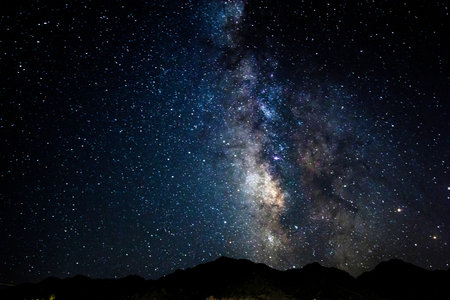 Milky way galaxy with stars and space dust in the universe. Long exposure photograph.with grain