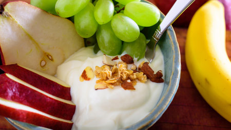 Healthy breakfast with yogurt, fruits and nuts. Selective focus.の写真素材